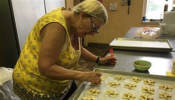 What does it take to have a parish festa? Hundreds of volunteers, bushels of food