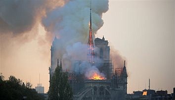 VOWS TO REBUILD NOTRE DAME