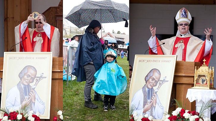 Thousands braved the rain and cold temperatures to attend Mass on Divine Mercy Sunday at the National Shrine of Divine Mercy in Stockbridge, Mass., on Sunday, April 28. Bishop Edward Scharfenberger celebrated the Mass, blesses the crowd with the heart of St. Jean Vianney, the patron saint of parish priests, and gives out communion along with other priests. Divine Mercy is based on St. Faustina Kowalska’s visions and conversations she had with Jesus Christ, who asked St. Faustina to paint the vision of Divine Mercy. Divine Mercy Sunday is the first Sunday after Easter. (Nate Whitchurch photos)