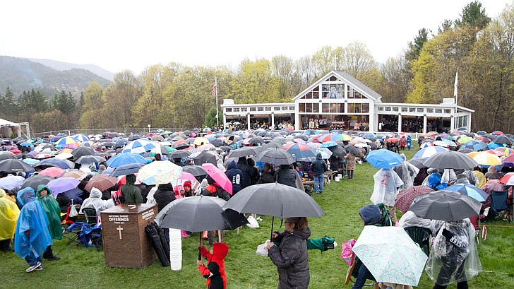 Thousands braved the rain and cold temperatures to attend Mass on Divine Mercy Sunday at the National Shrine of Divine Mercy in Stockbridge, Mass., on Sunday, April 28. Bishop Edward Scharfenberger celebrated the Mass, blesses the crowd with the heart of St. Jean Vianney, the patron saint of parish priests, and gives out communion along with other priests. Divine Mercy is based on St. Faustina Kowalska’s visions and conversations she had with Jesus Christ, who asked St. Faustina to paint the vision of Divine Mercy. Divine Mercy Sunday is the first Sunday after Easter. (Nate Whitchurch photos)