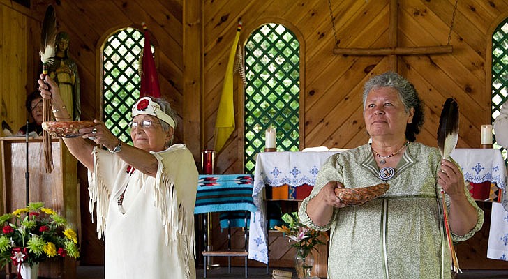 It was Saint Kateri Tekakwitha Feast Day weekend at the Saint Kateri Tekakwitha National Shrine and Historic Site in Fonda on July 13-14. Bishop Edward B. Scharfenberger celebrated Mass on Sunday along with Father James McCurry, OFM, and Father Tim Lyons. The Mass featured a smudging ritual and Four Direction Purification Ceremony.  Terry Steele and Laura Morris lead the parishioners in the Four Directions Prayer.  Photos by Nate Whitchurch. 