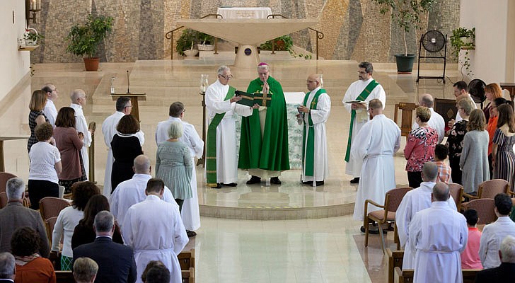 Future deacons celebrated the Rite of Admission to Candidacy for Holy Orders on Sunday,  Sept. 15, in a ceremony held at St. Joseph’s Chapel at St. Joseph's Provincial House in Latham with Bishop Edward B. Scharfenberger presiding. In this rite, candidates offer themselves to God and the Church, an official recognition of a vocation. Candidates and their wives, if they're married, attend a retreat before the ceremony.   Bishop Scharfenberger examines the candidates to the ministry of acolyte.  Photos by Nate Whitchurch